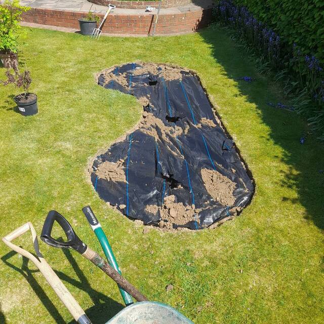 New border being dug and lined with weed barrier