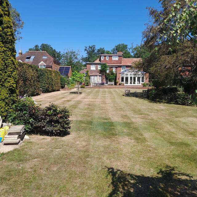 Long hedges and grass paths kept in order in Billingshurst
