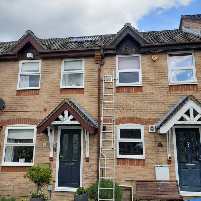 Before: worn fascias and soffits on a terraced house