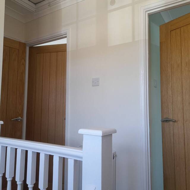 New oak internal doors hung on a landing