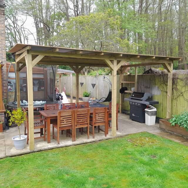 Covered timber pergola over a patio dining area built by Cordreys