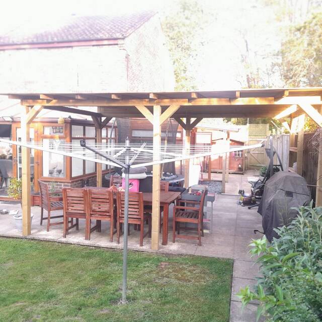 After: covered timber pergola over a patio dining area (3)