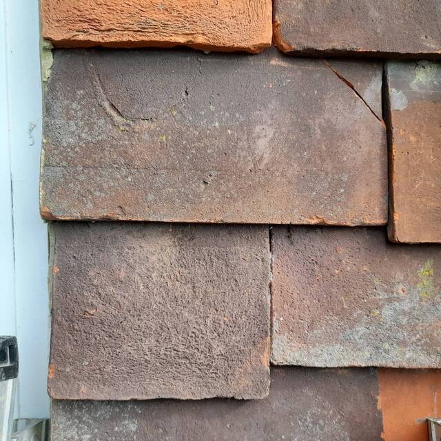 After: clay roof tiles beside a window